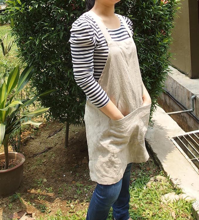 Heavyweight linen criss cross apron in natural color, with side pockets